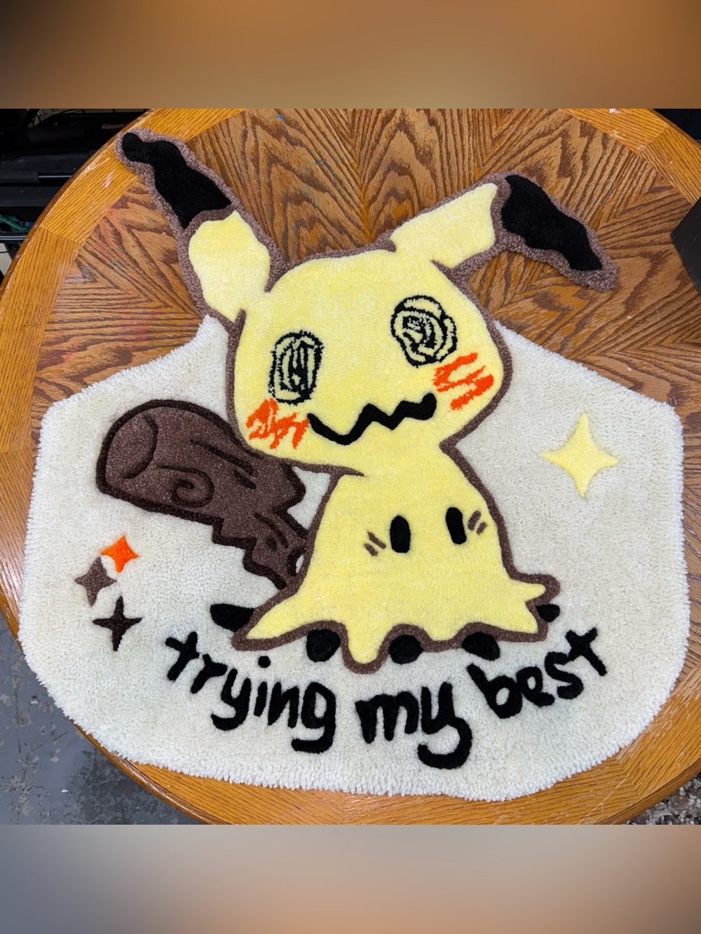 This is a Mimikyu hand-tufted custom rug featuring the phrase "trying my best".